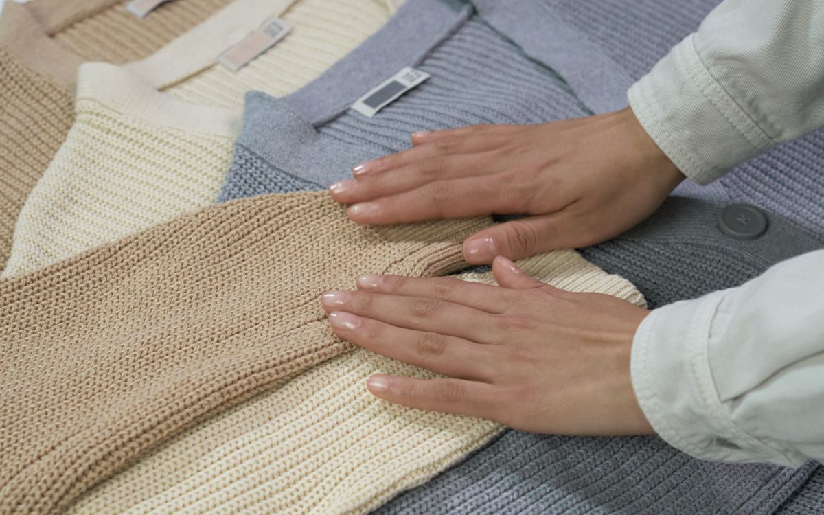 A person holding a yellow textile
