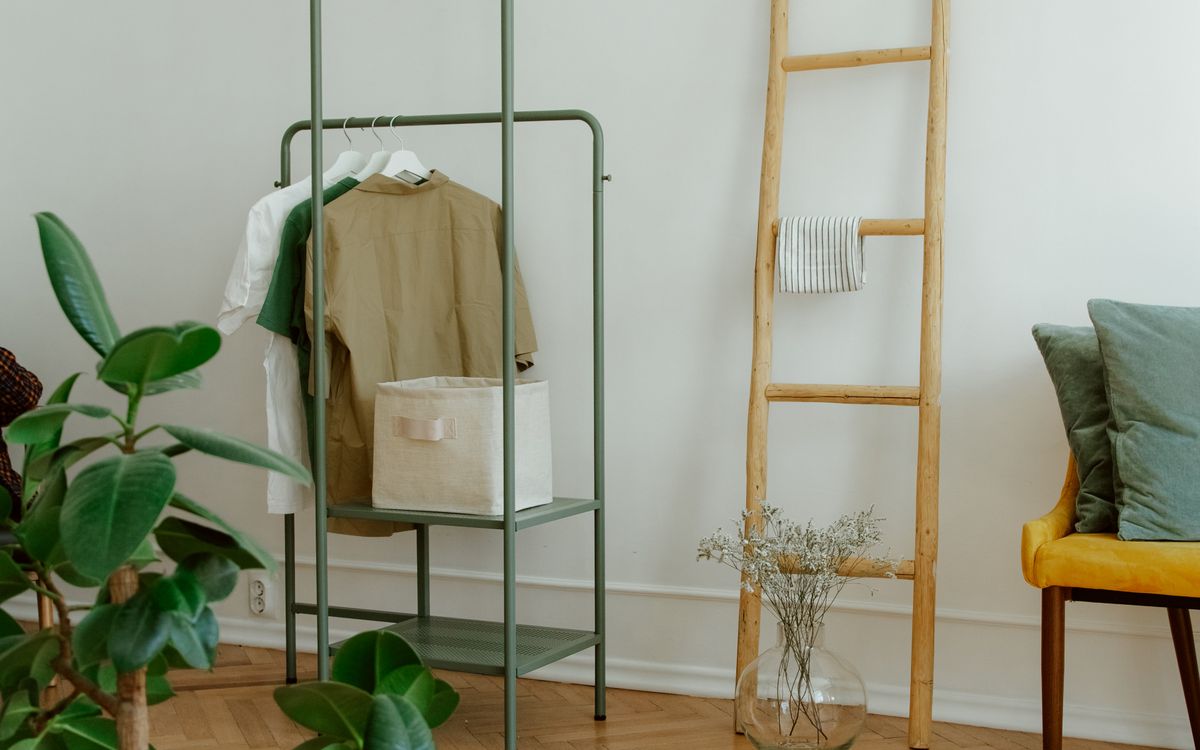 A minimalistic home interior with a clothing rail